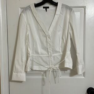 White collarless buttoned blouse. Can tie in front or back.